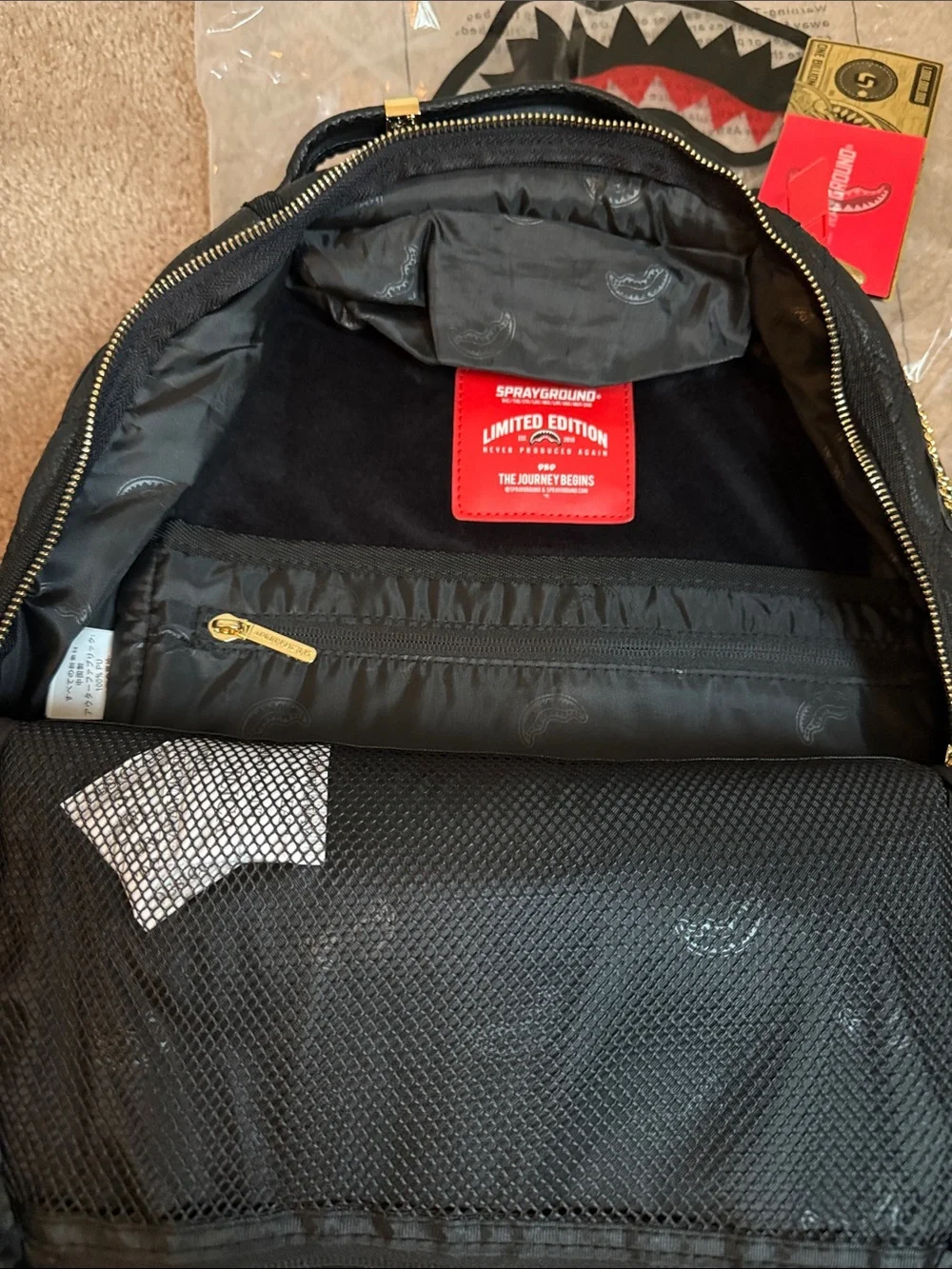 Quilted Black Backpack with Gold Chain Trim